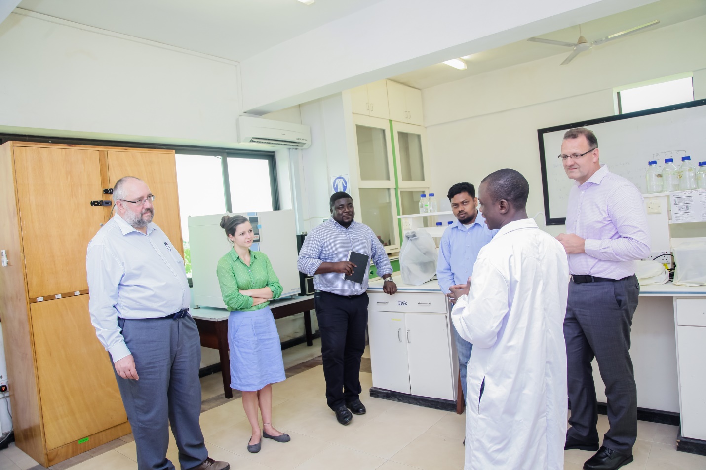 Research Assistant explaining a point to the Accreditation Assessment Panel during the tour of facilities at the Centre