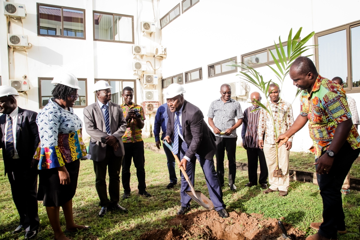 WACCBIP Director planting a tree on the site